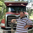 William 'Porkchop' poses with Mack dump truck