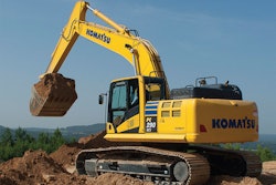 Komatsu PC290 Excavator scoops a bucket of dirt
