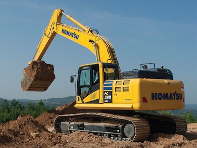 Komatsu PC290 Excavator scoops a bucket of dirt