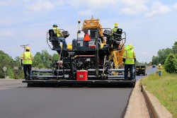 asphalt paver paving road