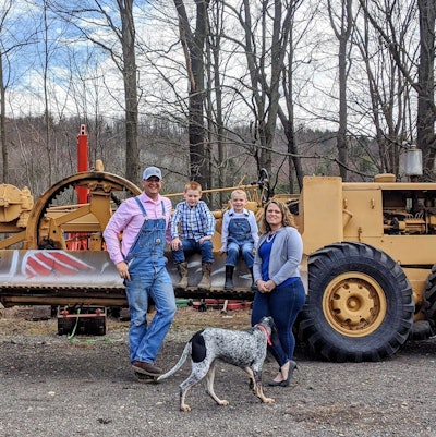 Garret Wilson and family with antique motor grader