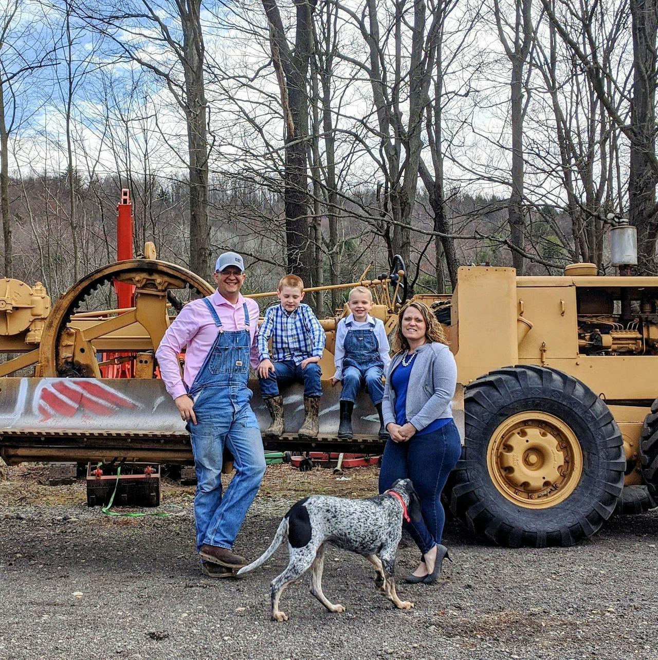 Garret Wilson and family with antique motor grader