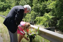 Marshall Walton Memorial Bridge parents place flowers