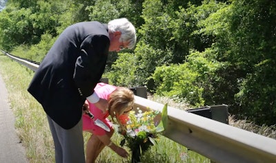 Marshall Walton Memorial Bridge parents place flowers