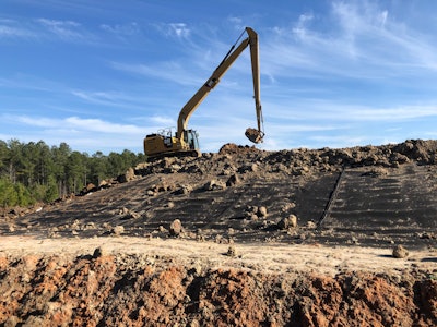 McGraley company cat excavator on landfill
