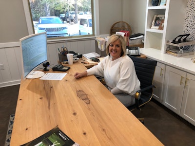 Nicole rahn at desk in office McGraley Company