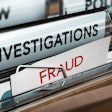File folders labeled investigations and fraud