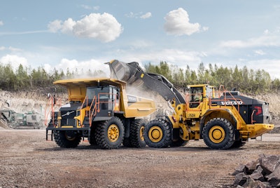 Volvo L350H wheel loader dumping load into haul truck