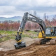 John Deere Excavator with a tiltrotator and bucket attachment