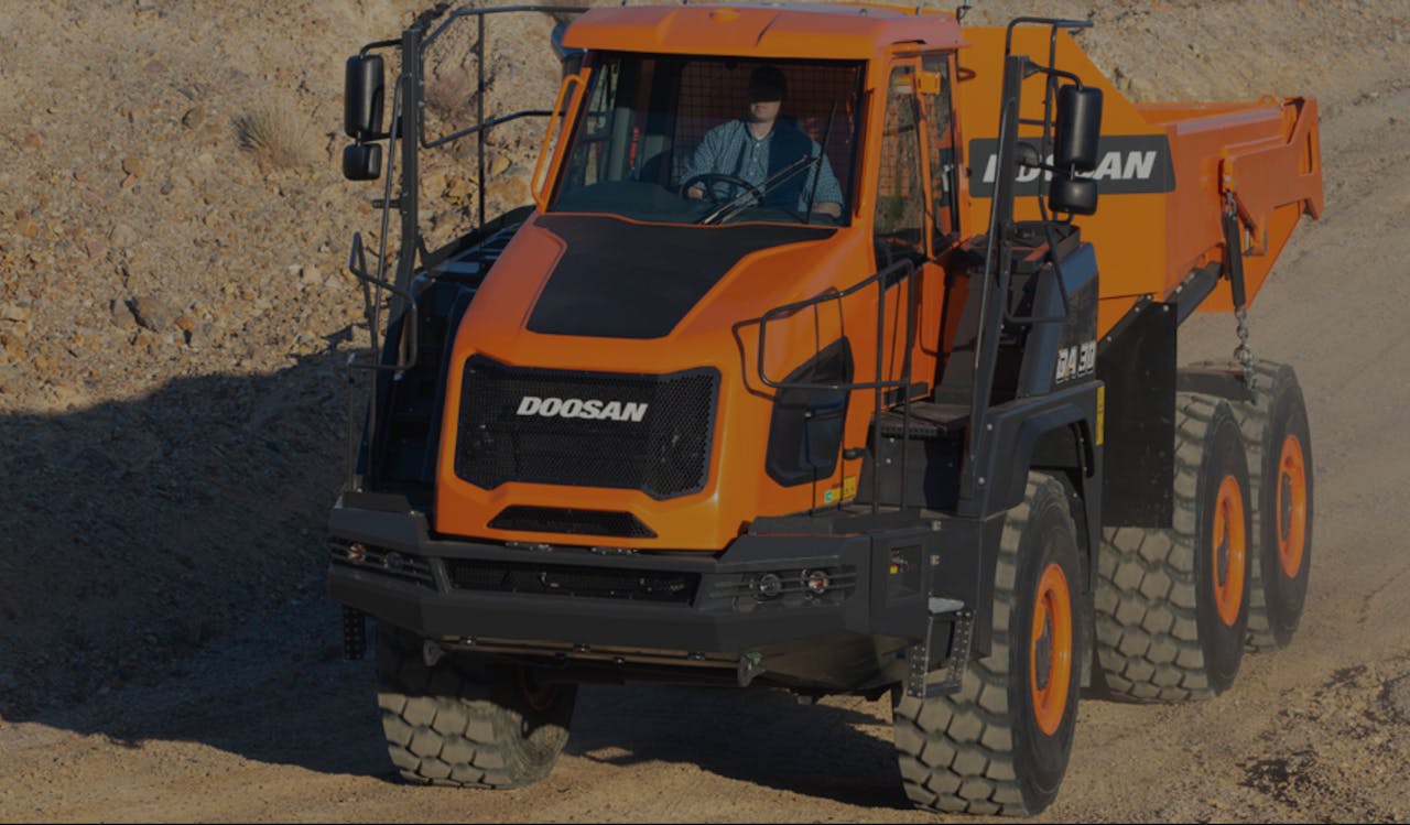 Doosan DA 30-5 articulated dump truck driving on dirt