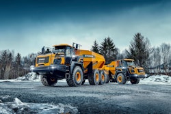 Hyundai new HA30 and HA45 articulated dump trucks on gravel road in snow