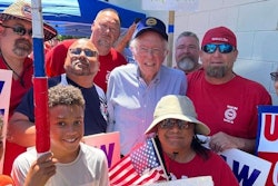 U.S. Sen. Bernie Sanders posing with stickers in Racine