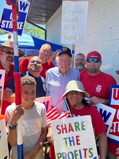 U.S. Sen. Bernie Sanders posing with stickers in Racine