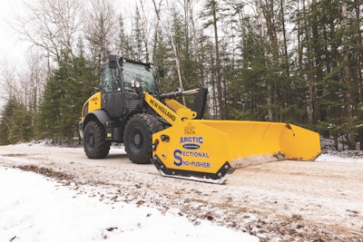 New Holland W80C compact wheel loader pushing snow