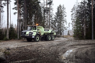 Volvo prototype HX04 hydrogen-powered articulated hauler carries load on dirt road