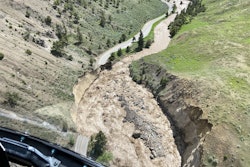 Flooding Yellowstone National Park aerial view of swollen Gardner River washes out park road