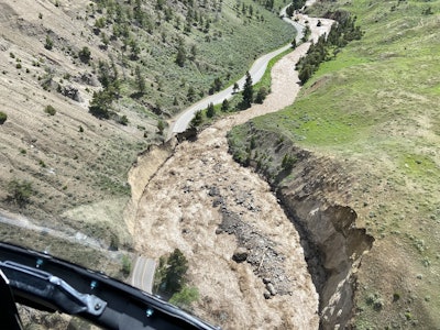 Flooding Yellowstone National Park aerial view of swollen Gardner River washes out park road