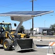Volvo Wheel Loader charging under a Beam Global EV Arc solar charging system