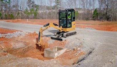 Caterpillar mini excavator digging