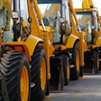 backhoes parked in a line