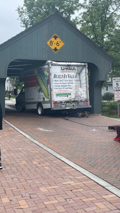 U-Haul truck stuck under historic covered bridge in Long Grove Illinois