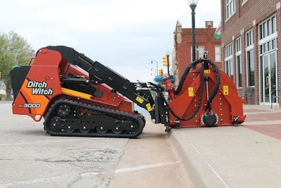 Ditch Witch MT165 microtrencher attachment on a SK3000 stand-on skid steer