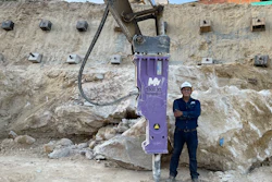 Mazio 1500XL hydraulic breaker man stands beside purple breaker