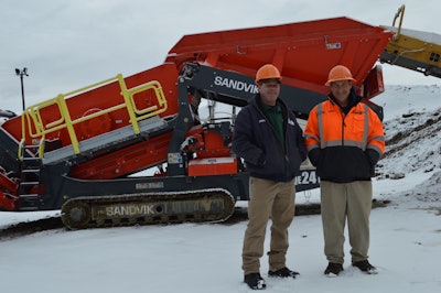 Tomkins Excavating Mark Tomkins with foreman Brian Teichman in front of Sandvik crusher