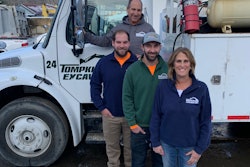 Tompkins Excavating family by white vocational truck