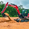 Yanmar SV100-2A mini excavator scooping dirt