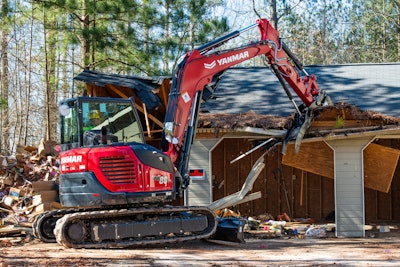 Yanmar ViO80-1A mini excavator demolishing a house