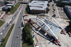 Second Avenue Bridge over I-94 Detroit being moved into place by self-propelled modular transporters