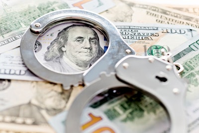 excavation company employee convicted in kickback scheme stock image handcuffs on $100 bills