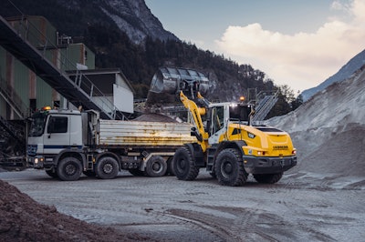 Liebherr L 538 wheel loader loading dump truck in quarry