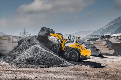 Liebherr L 546 wheel loader dumping gravel on gravel pile