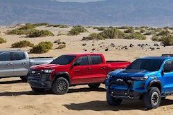 2023 Chevy Colorado lineup three models parked in desert gray red blue