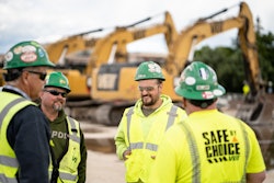 Group of construction workers talking