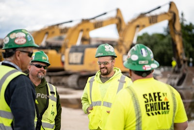 Group of construction workers talking