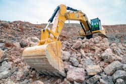 Cat 350 excavator with arm extended toward camera.