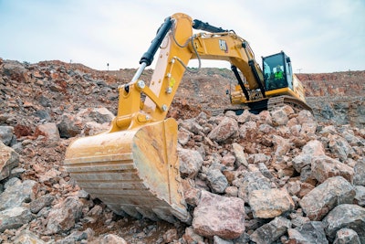 Cat 350 excavator with arm extended toward camera.