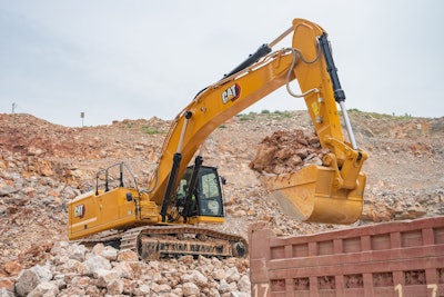 Cat 350 excavator preparing to dump a bucket load