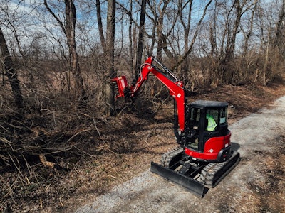 Fecon FMX28 Bull Hog Mulcher attachment on a compact excavator