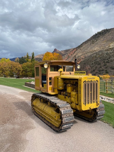 1940 Caterpillar D6 crawler tractor wooden cab restored parked on driveway in front of mountains