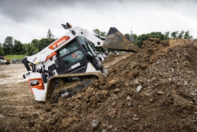 T86 loader driving up dirt pile