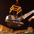 XCMG excavator being lifted by a crane