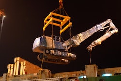 XCMG excavator being lifted by a crane