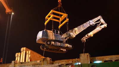 XCMG excavator being lifted by a crane