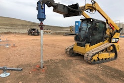 Caterpillar compact track loader installing a helical pier
