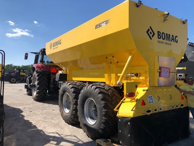 BOMAG BS 16 binder spreader in parking lot behind tractor