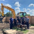 Blackhawk Equipment staff with a Hyundai Construction Equipment compact excavator